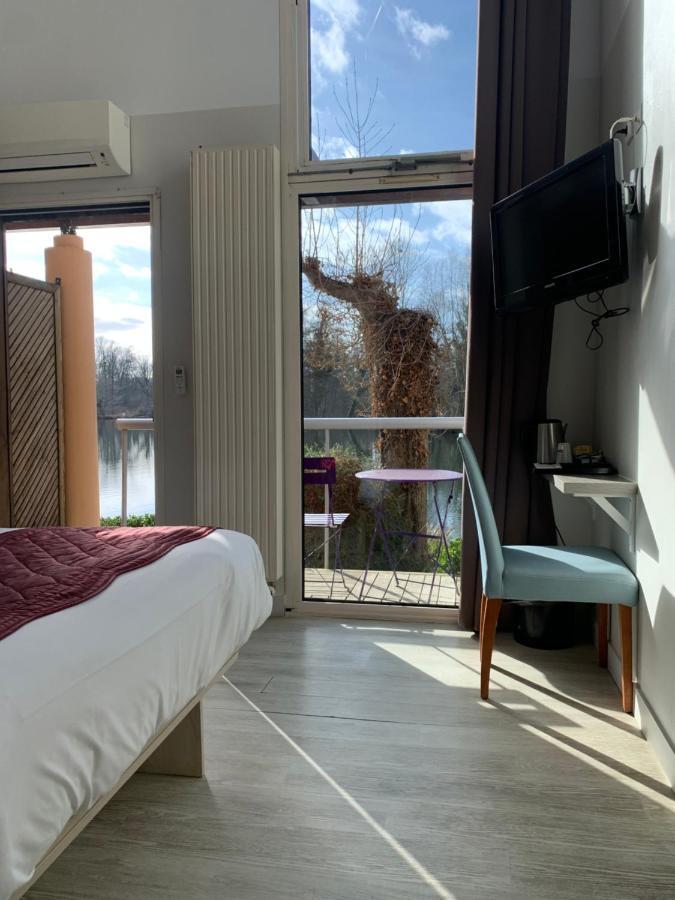 Hotel L'Ile Du Saussay Итвиль Экстерьер фото